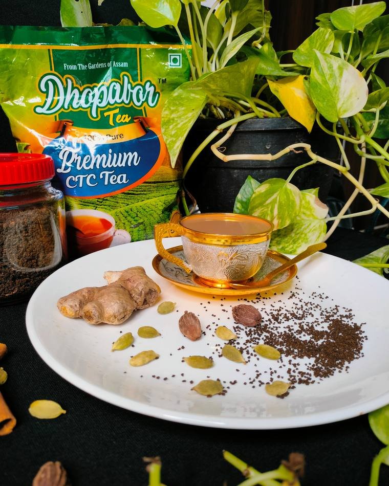 Dhopabor Premium CTC Tea pack styled with ginger and spices, packaging photography by Propix
